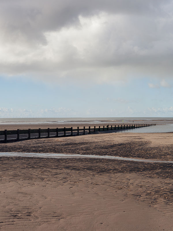 Fleetwood beach with the tide out on a cloudy day